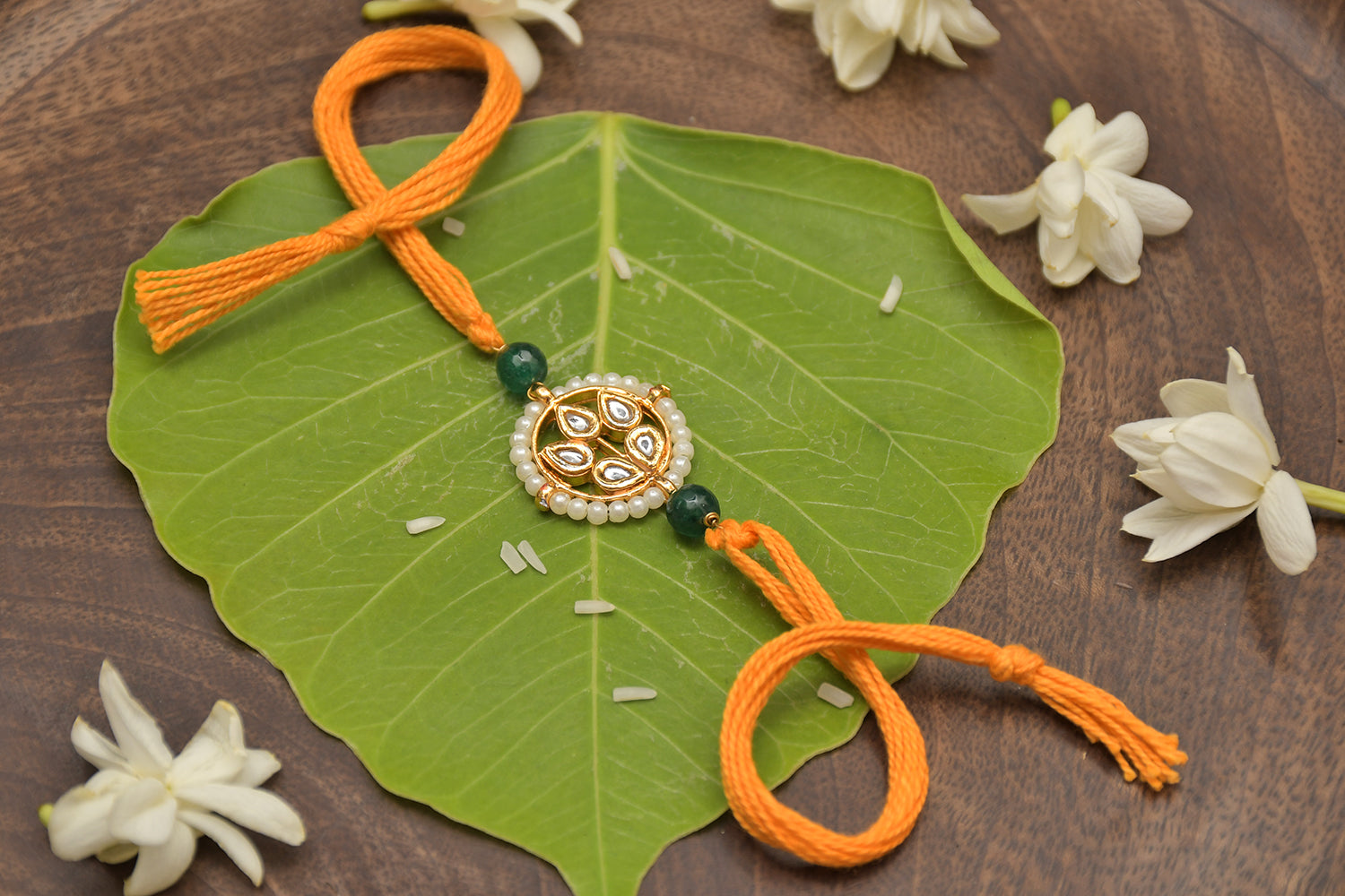 Kundan Floral Gold Tone Kundan Rakhi With Organish Yellow