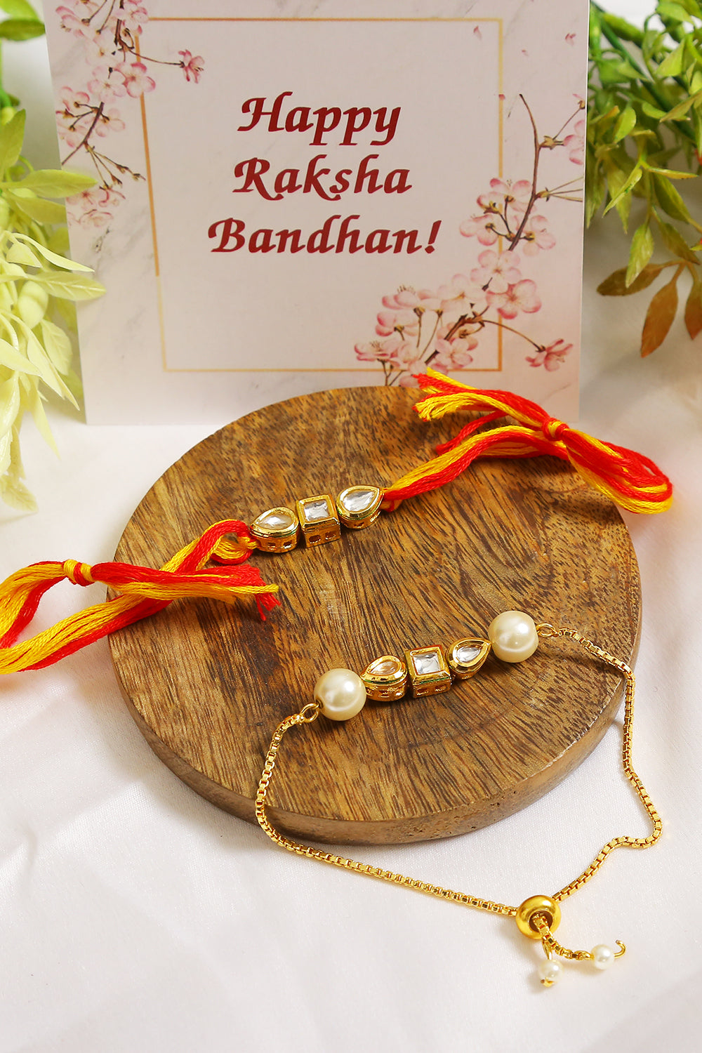 Set Of 2 - Gold-Toned Kundan Embellished Rakhi & Lumba Set